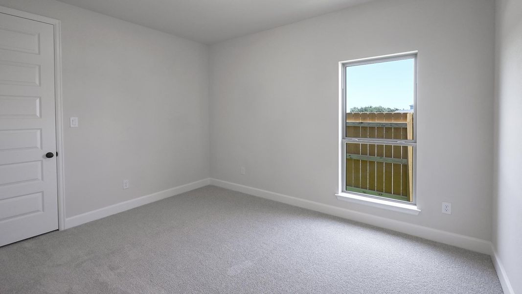 Spacious, unfurnished interior of a new home in 6 Creeks, Kyle (Image 14).