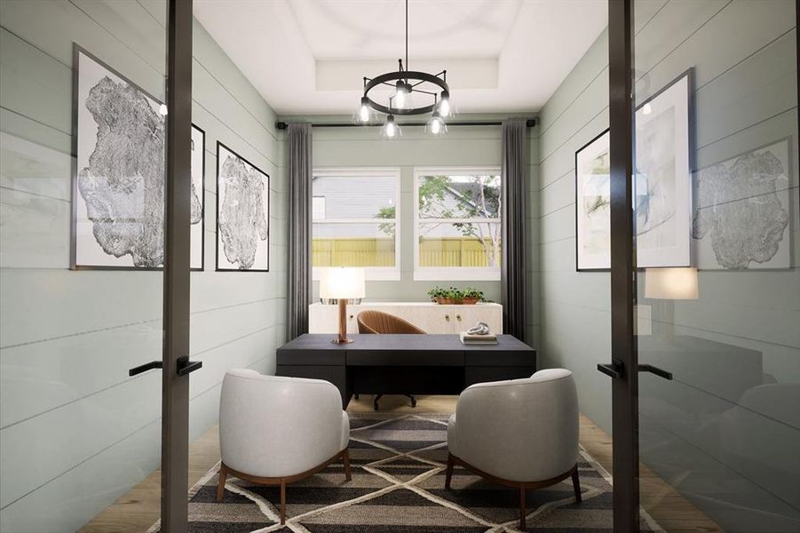 Office with french doors, wood walls, a tray ceiling, and wood finished floors Office with french doors, wood walls, a tray ceiling, and wood finished floors