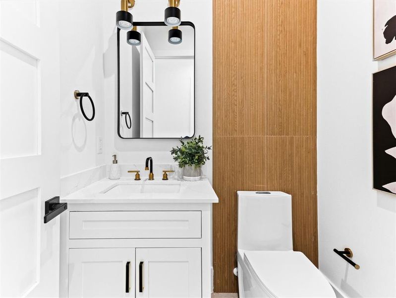 Bathroom featuring oversized vanity and toilet