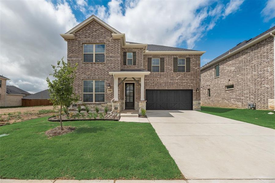 Front exterior of a new home in Sutton Fields, Celina, TX, highlighting curb appeal (Image 18).