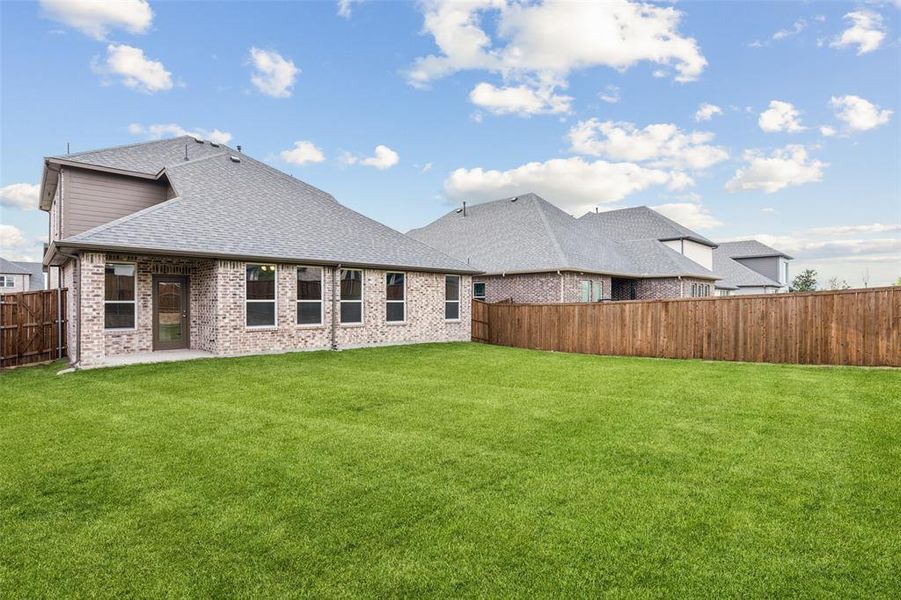 Front exterior of a new home in AnaCapri, Anna, TX, highlighting curb appeal (Image 1). Front exterior of a new home in AnaCapri, Anna, TX, highlighting curb appeal (Image 1).