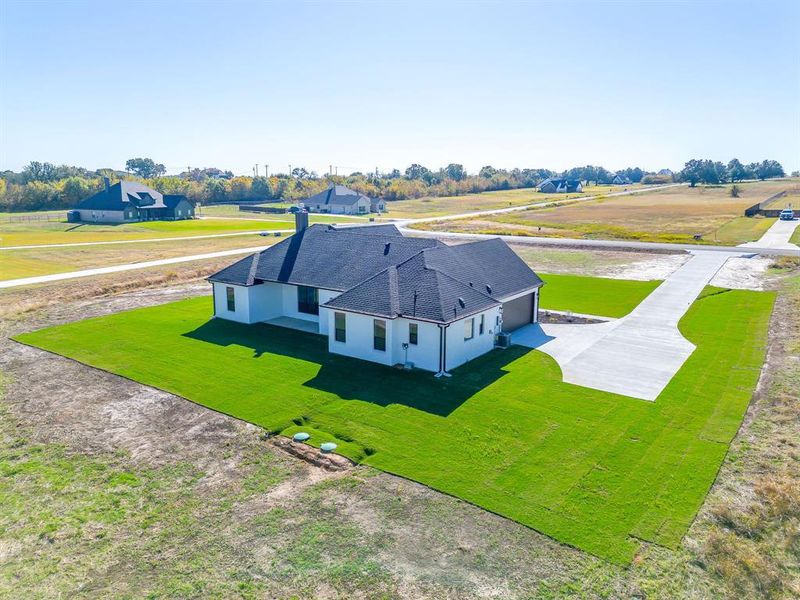 Front exterior of a new home in , Weatherford, TX, highlighting curb appeal (Image 22).