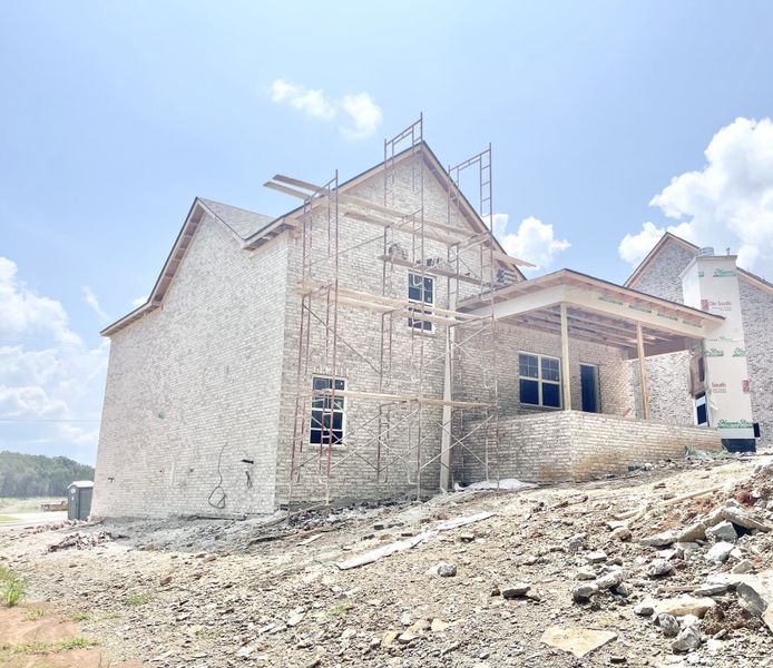 Stock photo Back view showing Jumbo porch with wood burning fireplace . Porch will be tricked out with LED lights and ceiling fans