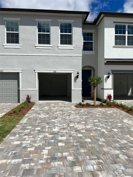Front exterior of a new home in , West Palm Beach, FL, highlighting curb appeal (Image 1).