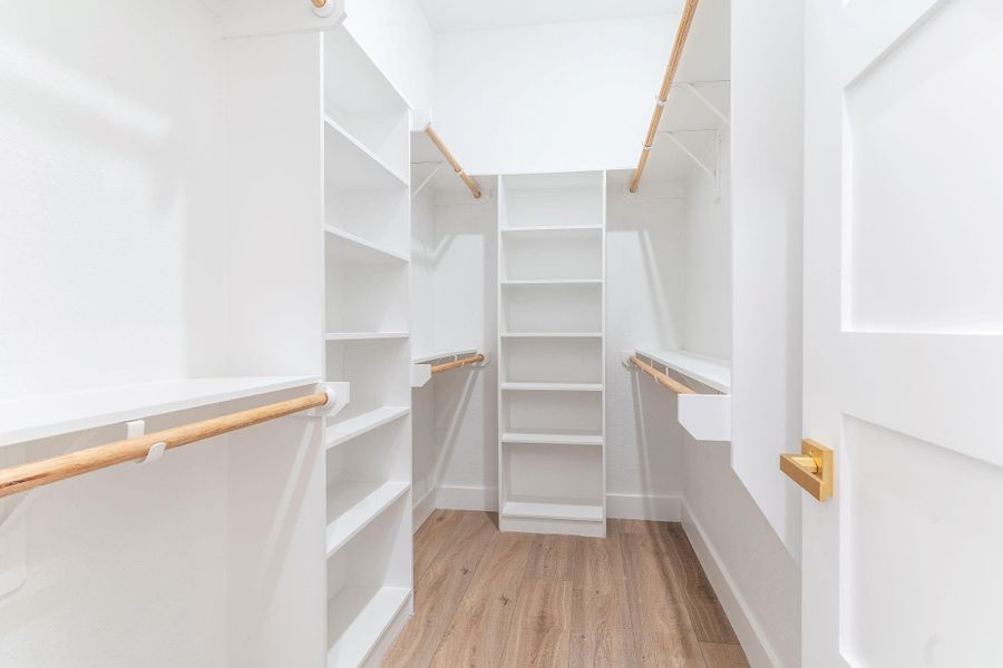 One side of two walk in closets
