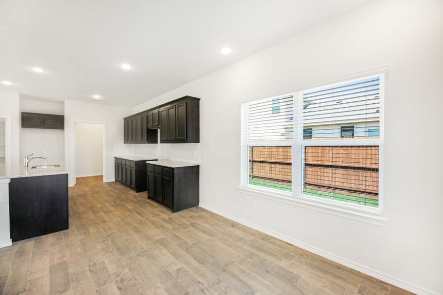 Representative exterior photo of a completed home built from the Lockhart by Impression Homes in Heartland, Heartland, TX (Image 13).