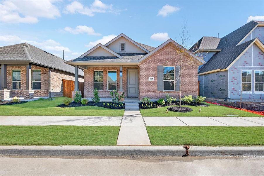 Front exterior of a new home in Tarrytown, Crowley, TX, highlighting curb appeal (Image 2).