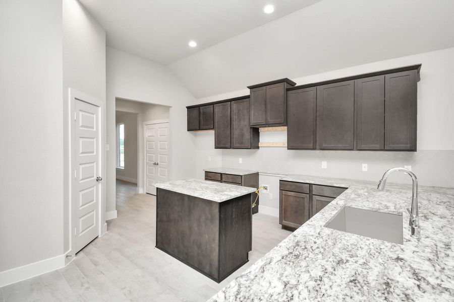 Example of completed home with similar plan. As-built colors and selections may vary.