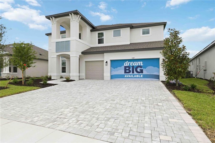 Front exterior of a new home in Creeks Edge at Twin Rivers, Parrish, FL, highlighting curb appeal (Image 2). Front exterior of a new home in Creeks Edge at Twin Rivers, Parrish, FL, highlighting curb appeal (Image 2).