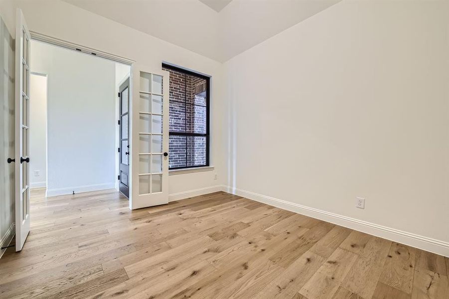 Spare room with light hardwood / wood-style flooring