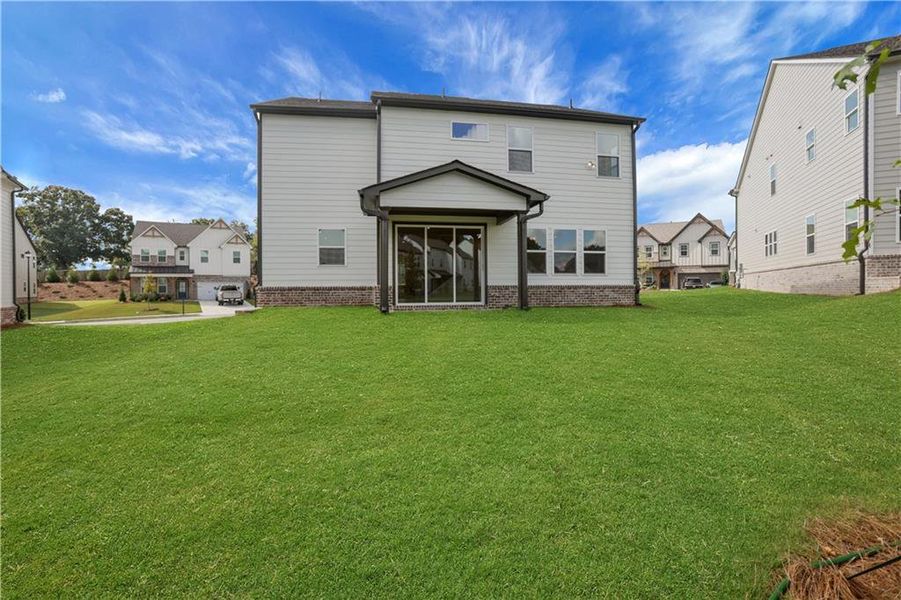 Exterior details and patio area of a home in The Paddocks at Doc Hughes, Buford (Image 3).