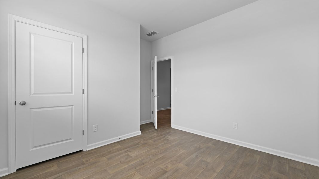 Representative unfurnished interior of a home built from the CALI by D.R. Horton in The Ranch, Holly Hill (Image 12).