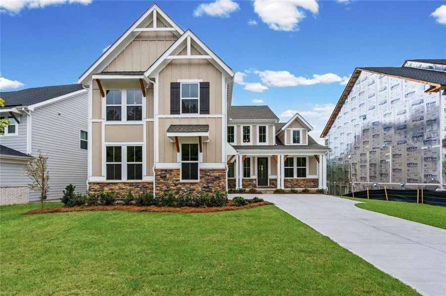 Front exterior of a new home in Twin Lakes, Hoschton, GA, highlighting curb appeal (Image 20). Front exterior of a new home in Twin Lakes, Hoschton, GA, highlighting curb appeal (Image 20).