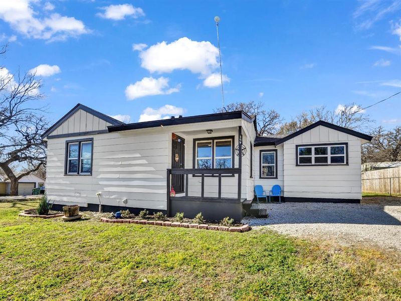 Exterior details and patio area of a home in , Springtown (Image 3).