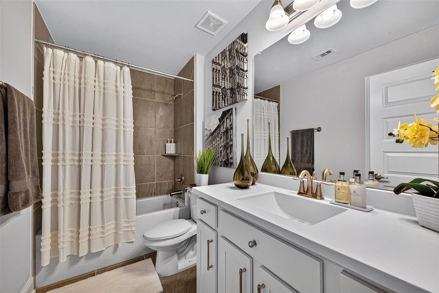 Furnished interior view inside a new home in Sunterra, Katy (Image 24).