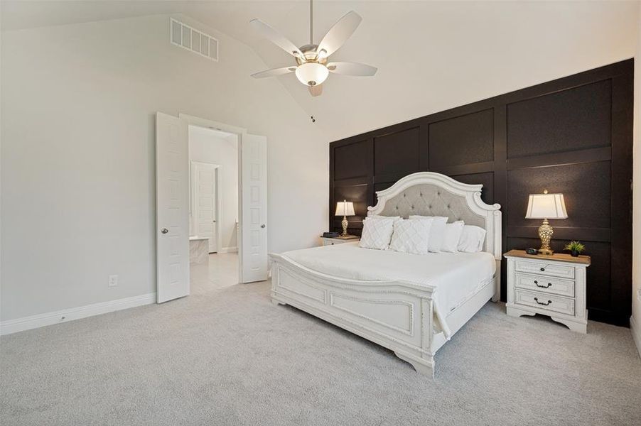 Retreat to the spacious primary suite featuring plush carpeting, abundant natural light, and a striking accent wall that adds warmth and character. The room easily accommodates large furniture while maintaining an open and airy feel, creating the perfect space to relax and unwind at the end of the day. Elegant finishes and a soothing color palette make this owner's retreat both comfortable and inviting. Retreat to the spacious primary suite featuring plush carpeting, abundant natural light, and a striking accent wall that adds warmth and character. The room easily accommodates large furniture while maintaining an open and airy feel, creating the perfect space to relax and unwind at the end of the day. Elegant finishes and a soothing color palette make this owner's retreat both comfortable and inviting.