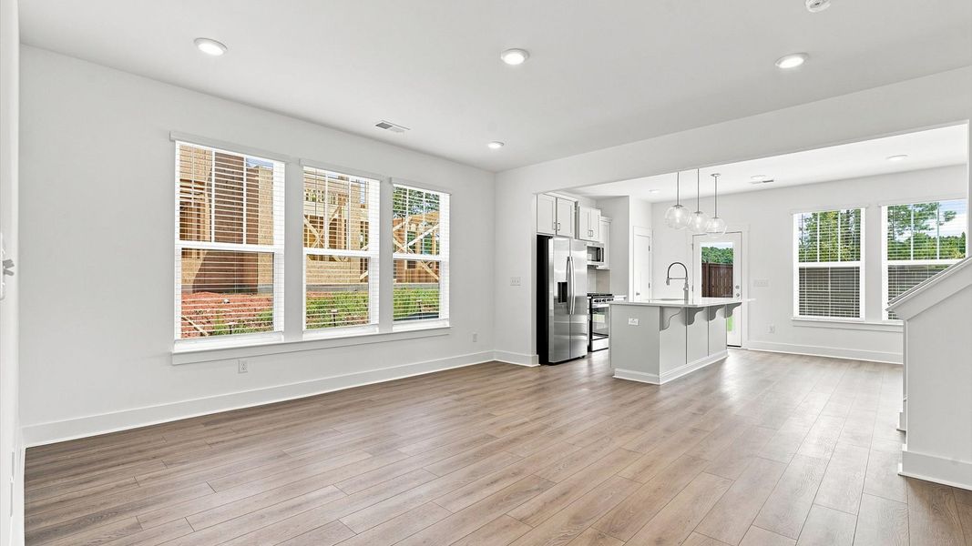 Hardwood flooring and high standards define this vibrant family room ideal for everyday living Hardwood flooring and high standards define this vibrant family room ideal for everyday living