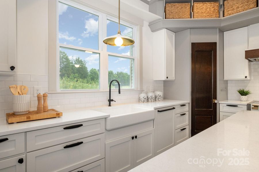 Lovely farmhouse sink, with large windows overlooking the private rear yard Lovely farmhouse sink, with large windows overlooking the private rear yard