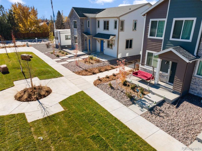 Front exterior of a new home in , Longmont, CO, highlighting curb appeal (Image 1).