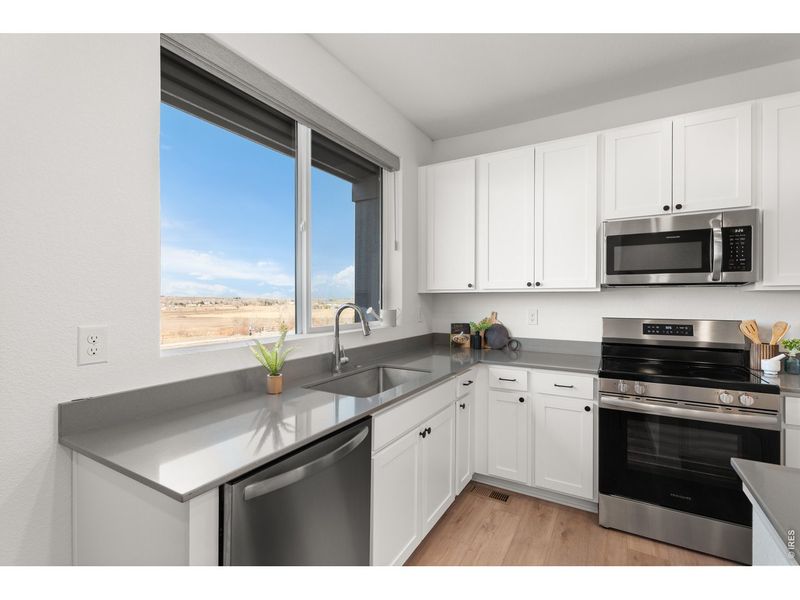 Furnished interior view inside a new home in Whisper Village, Arvada (Image 6).