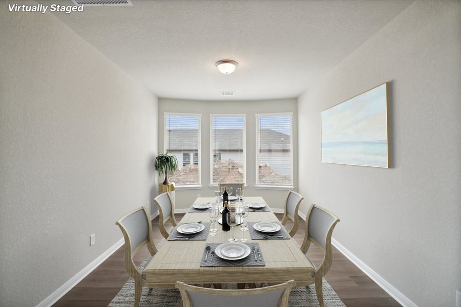 Virtually staged dining room in the Rio Grande floorplan at a Meritage Homes community. Virtually staged dining room in the Rio Grande floorplan at a Meritage Homes community.