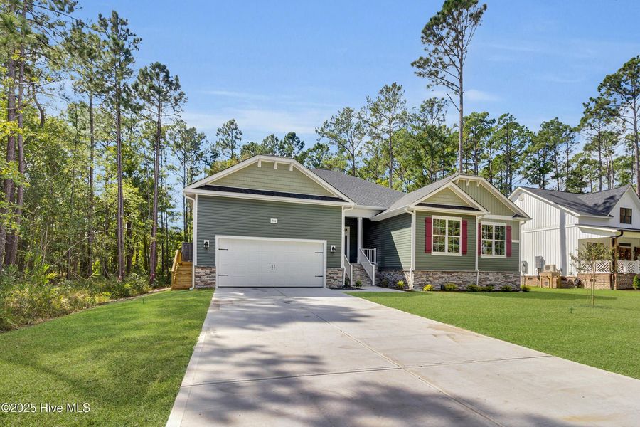 Front exterior of a new home in Fairfield Harbour, New Bern, NC, highlighting curb appeal (Image 1).