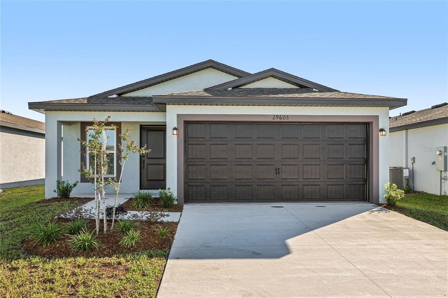 Front exterior of a new home in Trilby Crossing, Brooksville, FL, highlighting curb appeal (Image 1). Front exterior of a new home in Trilby Crossing, Brooksville, FL, highlighting curb appeal (Image 1).