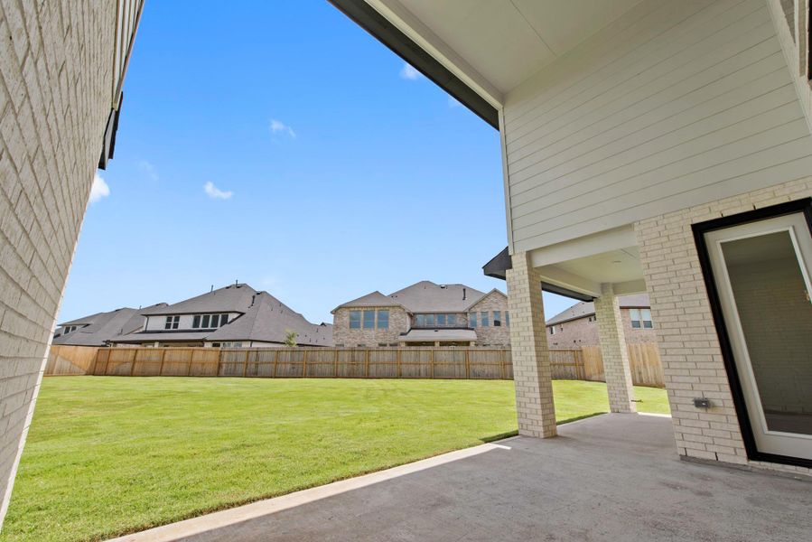 Exterior details and patio area of a home in Harvest Green, Richmond (Image 2). Exterior details and patio area of a home in Harvest Green, Richmond (Image 2).