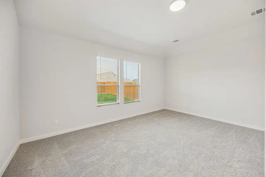 Primary Suite in the Stanley II home plan by Trophy Signature Homes – REPRESENTATIVE PHOTO