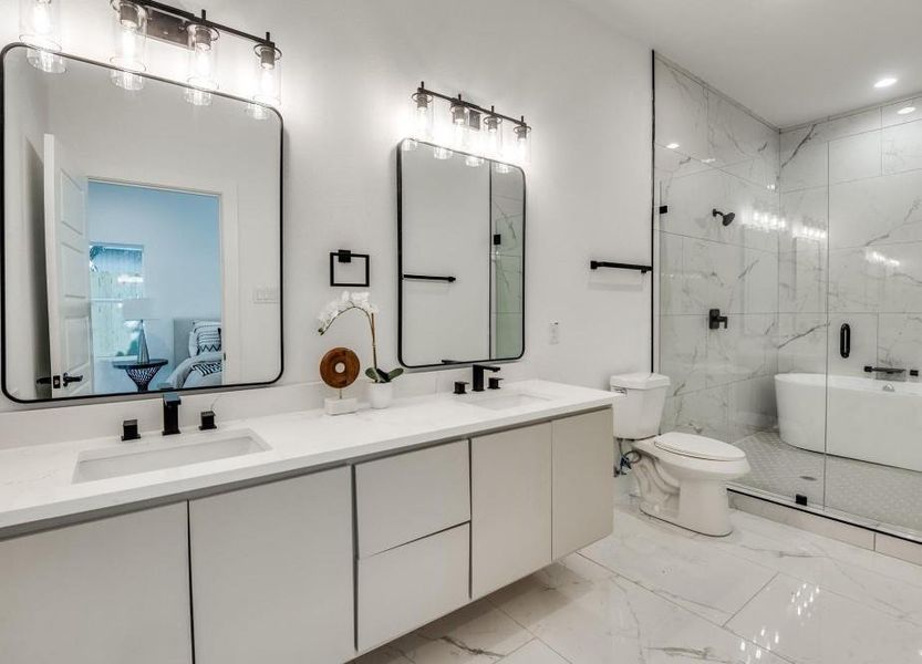 Bathroom with a shower with shower door, toilet, tile patterned flooring, and dual bowl vanity