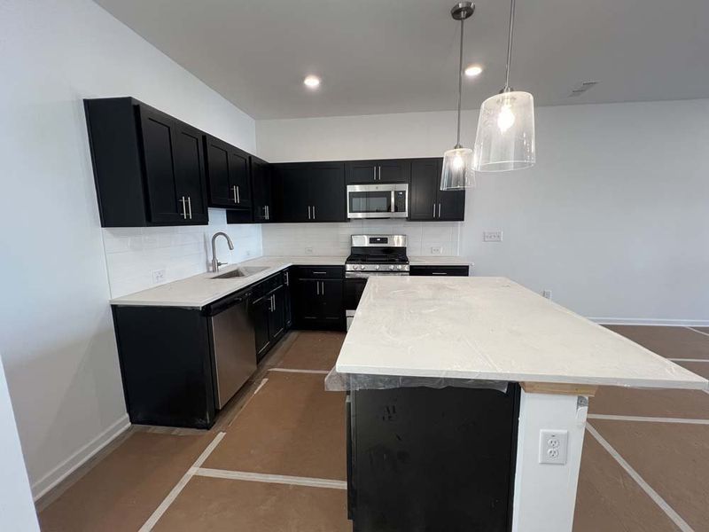 Kitchen featuring Industrial Collection Finishes Construction Progress