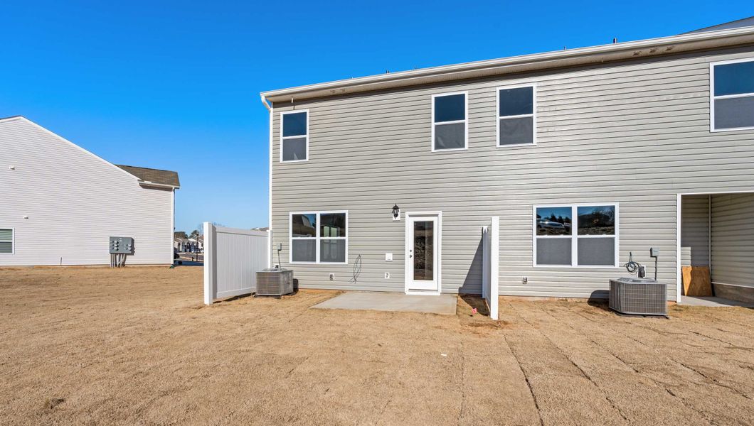 Front exterior of a new home in Tanglewood Townes, Greenville, SC, highlighting curb appeal (Image 2).