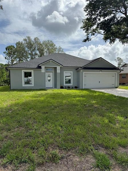 Front exterior of a new home in , Deltona, FL, highlighting curb appeal (Image 17).