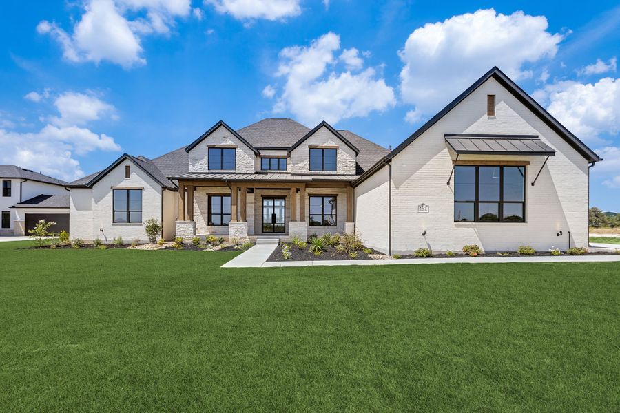 Front exterior of a new home in Hilltop Ranch, Leander, TX, highlighting curb appeal (Image 2). Front exterior of a new home in Hilltop Ranch, Leander, TX, highlighting curb appeal (Image 2).