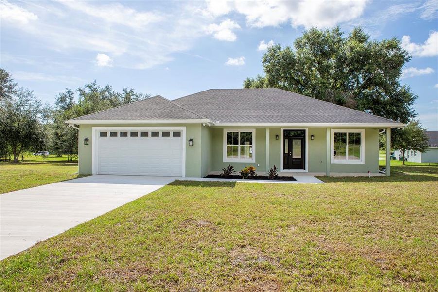 Front exterior of a new home in , Citrus Springs, FL, highlighting curb appeal (Image 24).