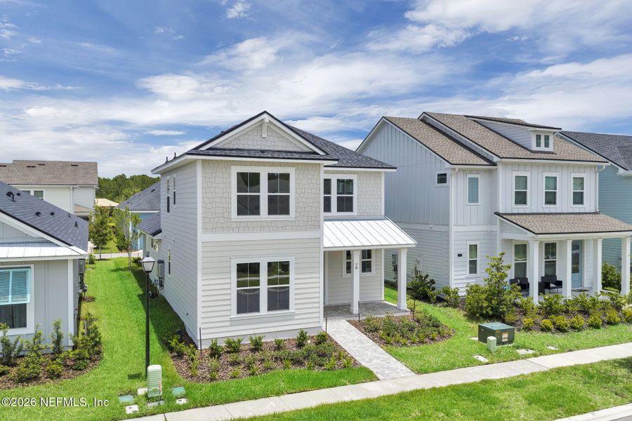 Front exterior of a new home in Seabrook Village at Seabrook, Nocatee, FL, highlighting curb appeal (Image 25).