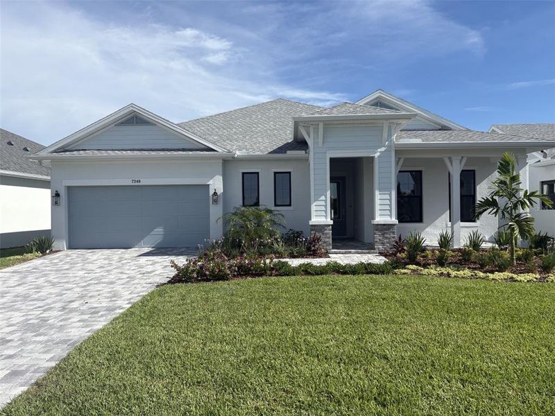 Front exterior of a new home in Lakeview Crossing – Classic Series, Sarasota, FL, highlighting curb appeal (Image 2). Front exterior of a new home in Lakeview Crossing – Classic Series, Sarasota, FL, highlighting curb appeal (Image 2).