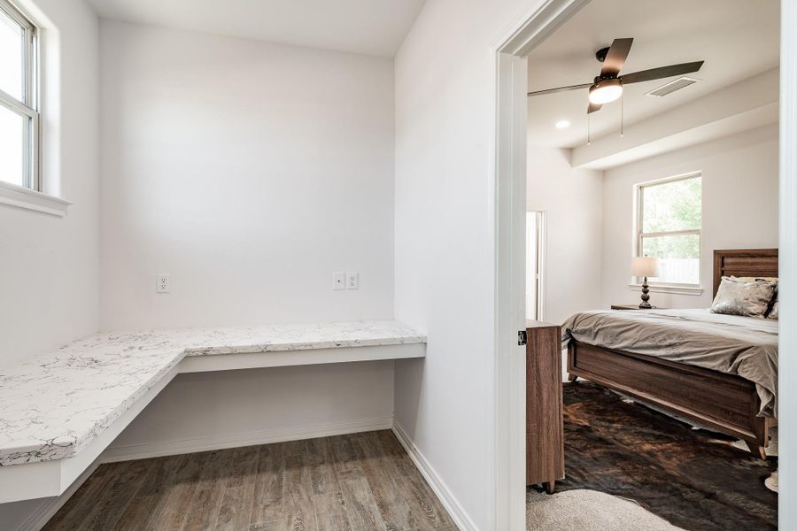 Convenient entry space with built-in storage and utility access.