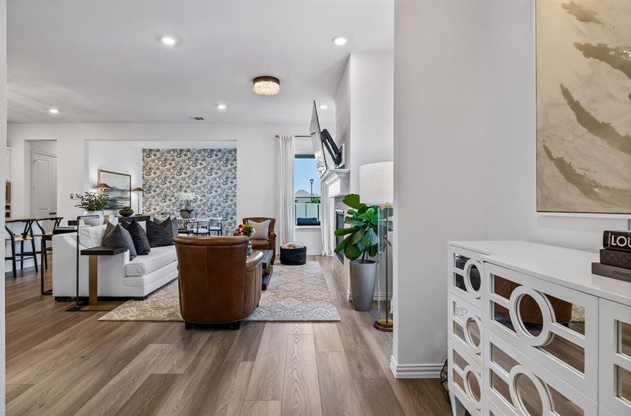 Living room with light hardwood / wood-style floors