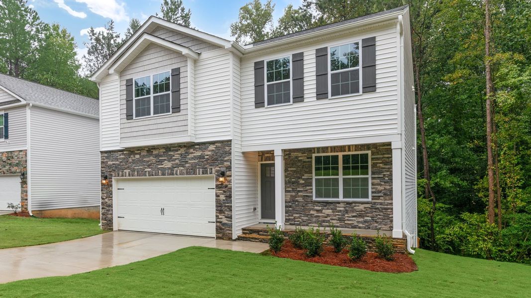 Front exterior of a new home in Ridgewood Farms, Winterville, NC, highlighting curb appeal (Image 16).