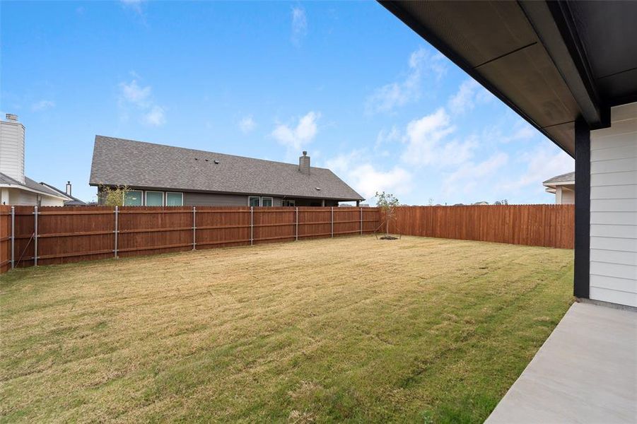 Exterior details and patio area of a home in Covenant Park, Springtown (Image 25).