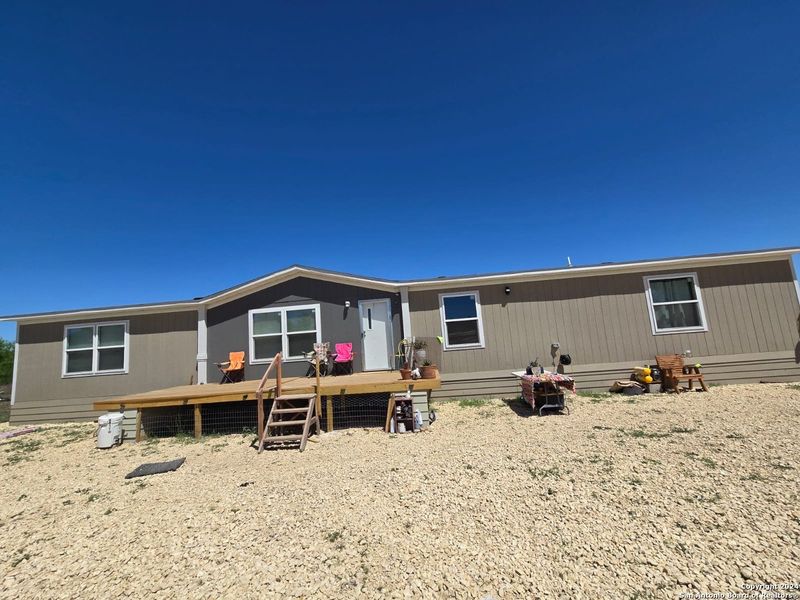 Front exterior of a new home in , La Pryor, TX, highlighting curb appeal (Image 5).