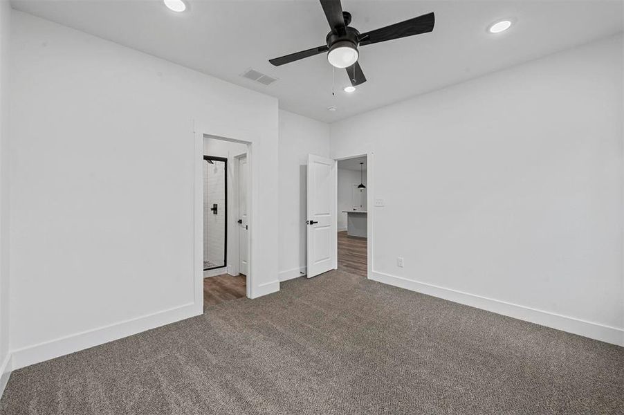 Unfurnished bedroom with carpet and ceiling fan