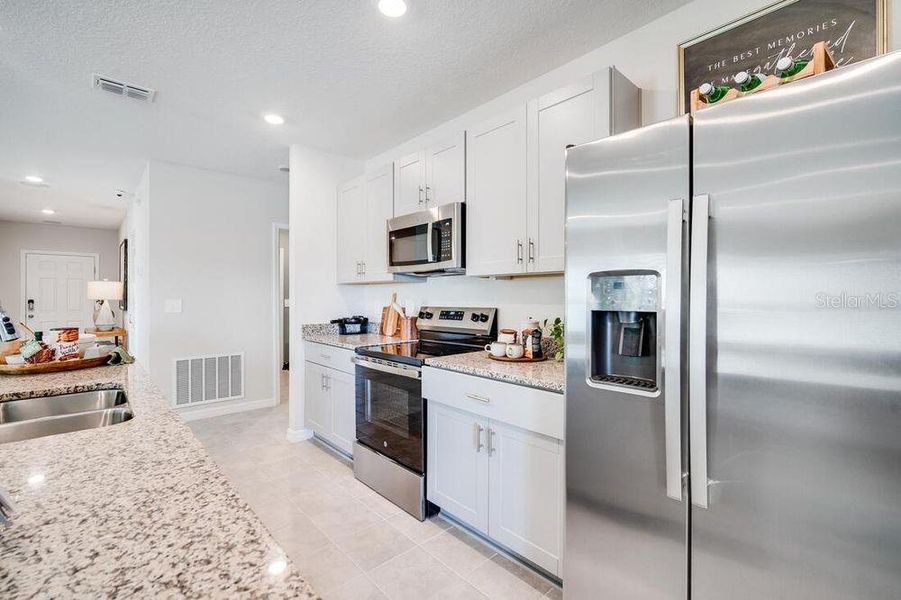 Furnished interior view inside a new home in Waterstone, Groveland (Image 9).