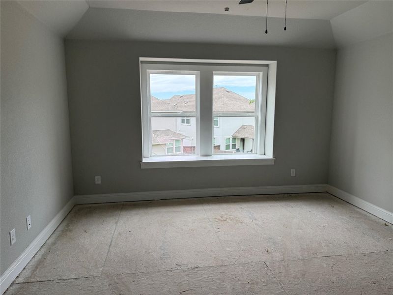 Bonus room with baseboards and a ceiling fan Bonus room with baseboards and a ceiling fan