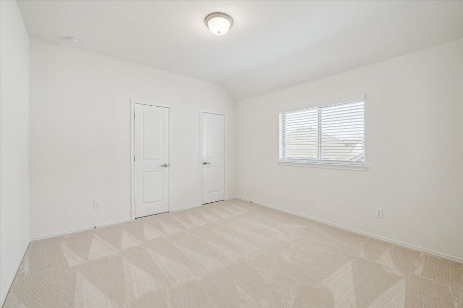 Additional secondary bedroom featuring two closets, abundant space, and plenty of natural light.