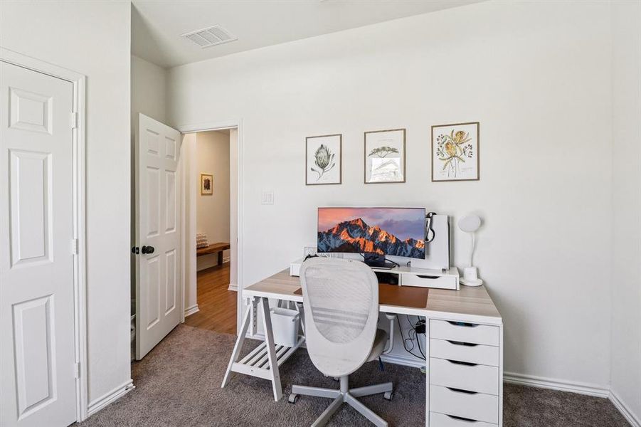 Office area with dark colored carpet Office area with dark colored carpet