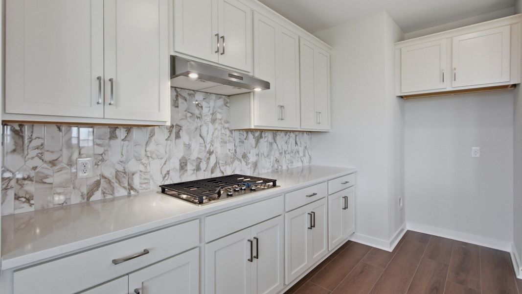 Countertop space with elevated quartz backwash Countertop space with elevated quartz backwash