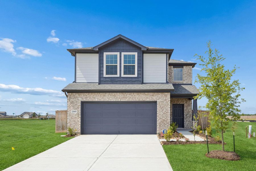 Front exterior of a new home in River Ranch, Dayton, TX, highlighting curb appeal (Image 16).