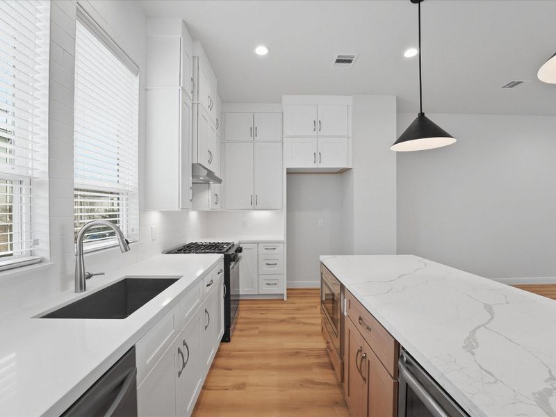 Furnished interior view inside a new home in The Corner At Buffalo Pointe, Houston (Image 13).